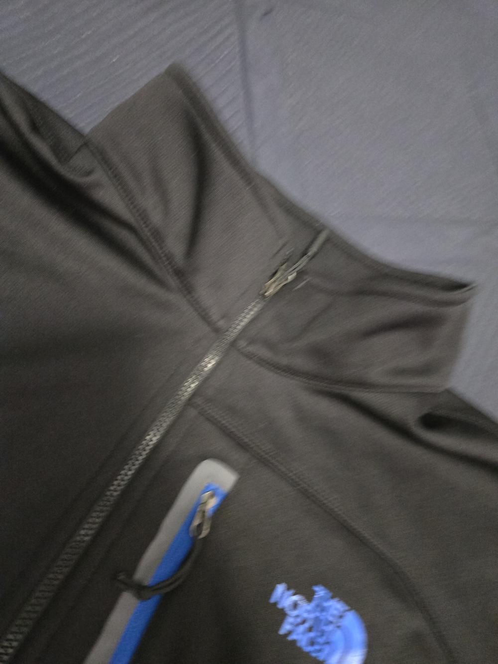 The North Face Men’s Black Softshell Jacket with Blue Logo